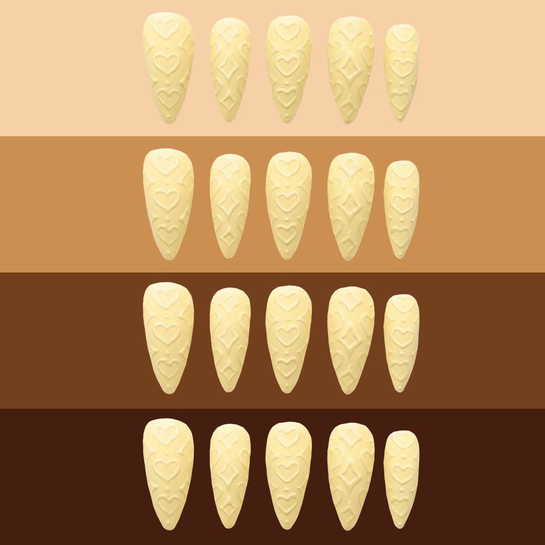 Powder Puff press-ons on different skin tone colors.