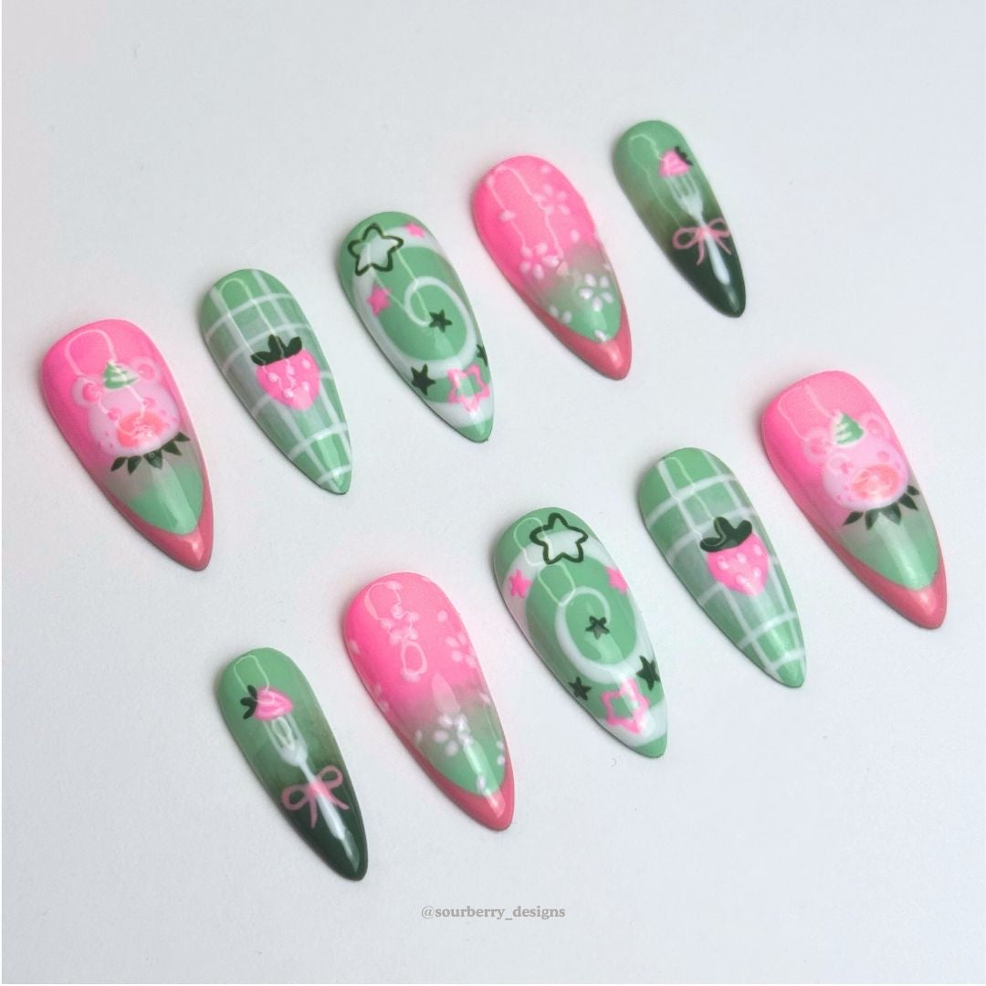 A different angle of the strawberry matcha nails.