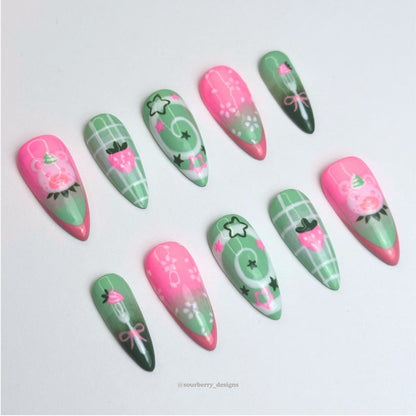 A different angle of the strawberry matcha nails.