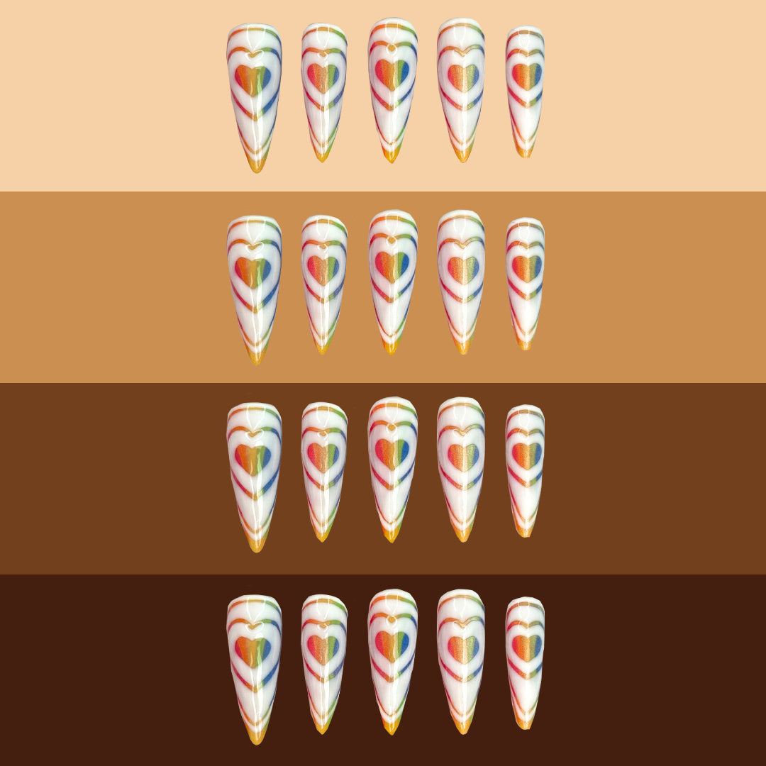 Rainbow Love Bomb Nails on different skin tones.
