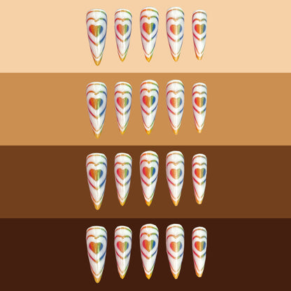 Rainbow Love Bomb Nails on different skin tones.